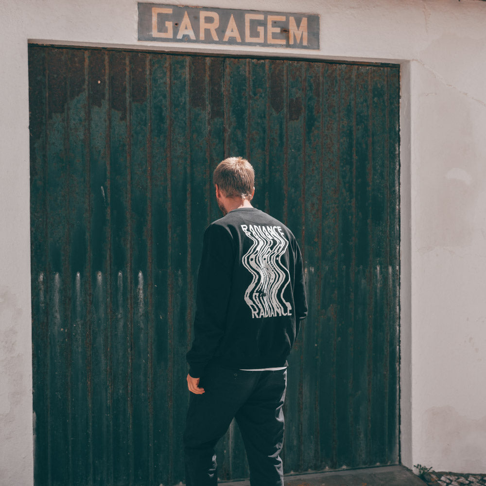 Man wearing radiance blurred crewneck/sweatshirt back