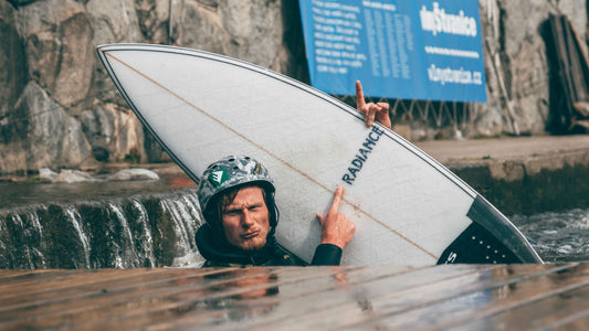 Guy holding The Heater Riversurfboard