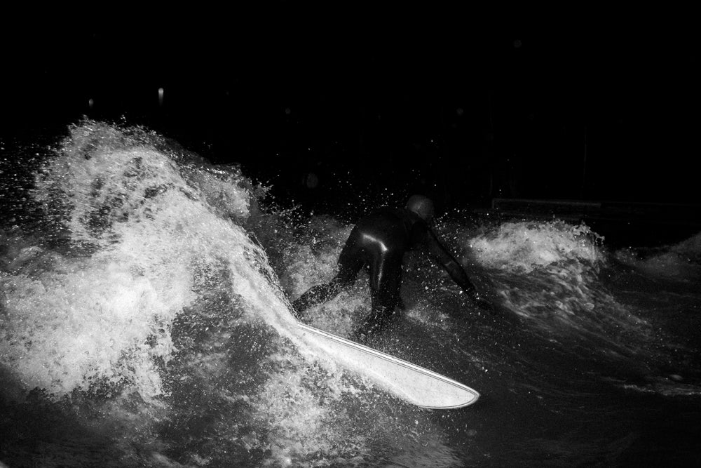 Guy surfing the radiance shiner river surfboard